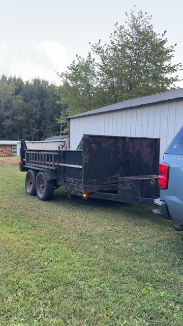 TN Services dump trailer used for hauling cleared brush and debris